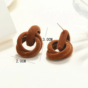 Close-up of brown flocked intertwined hoop earrings showing 3.0cm by 2.0cm dimensions