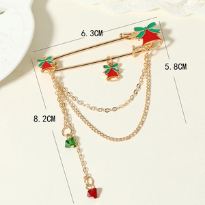 Christmas alloy brooch with red green bells and gold tassel chains on beige lace