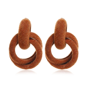 Detail view of brown flocked geometric interlocking hoop earrings with soft velvet texture