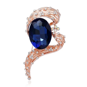 Elegant rose gold brooch featuring a large oval blue gemstone with sparkling accents