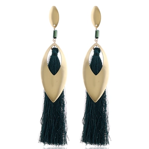 Detail of bohemian long tassel earrings with green beads and gold leaf pendants
