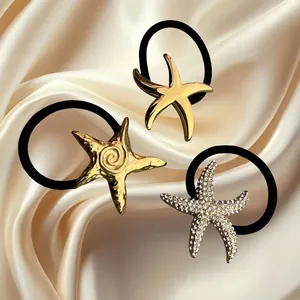 Set da tre elastici per capelli a stella marina con finitura oro e strass lucidi