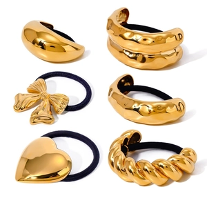 Set of six gold stainless steel hair rings with wave, heart, and bow designs