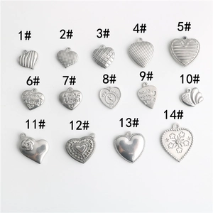 Set of 14 assorted stainless steel heart pendants with various textures for DIY jewelry