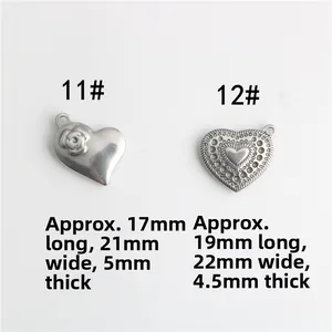 Detail view of engraved rose pattern and vintage wavy border heart charms for jewelry DIY