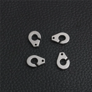 Detailed macro view of four stainless steel punk style handcuff clasps for DIY jewelry making