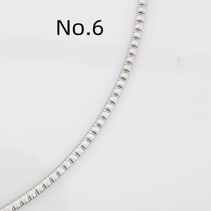 Macro view showing the precision diagonal embossed texture on this silver stainless steel chain