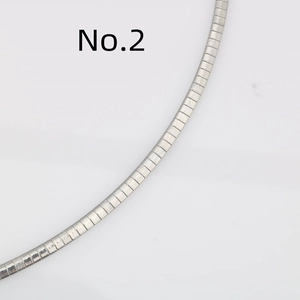Polished and frosted silver stainless steel flat snake chain necklace on white background