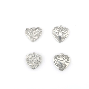 Set of four stainless steel heart pendants featuring angel wing and tree of life designs