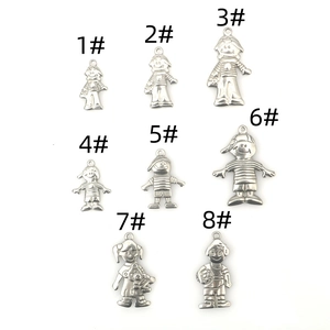 Selection of eight distinct stainless steel boy and girl pendants with matte finish