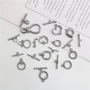 Detailed macro shot of stainless steel OT heart and round jewelry toggle clasps for DIY