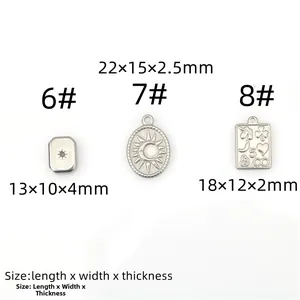 Detailed view of stainless steel pendants with sun motifs and celestial engravings