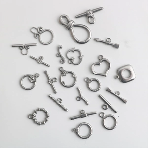 Macro shot of silver stainless steel heart and toggle OT clasps for DIY jewelry making