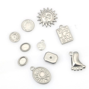 Vintage stainless steel pendants featuring sun, moon, and coin motifs in antique silver finish