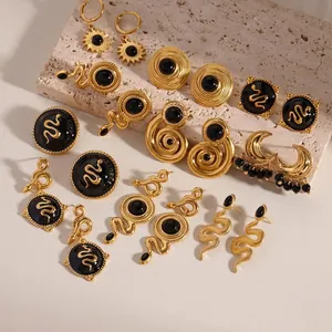 Vintage gold and black onyx stainless steel earrings set with celestial and snake designs