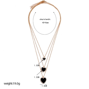 Three-layer gold necklace set featuring black heart pendants with size specifications