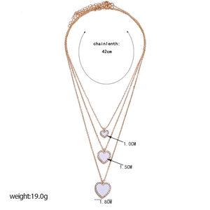 Detailed view of triple-layered gold heart necklaces with size and weight specifications