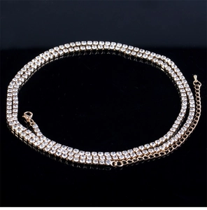 Close-up of gold body chain with three rows of rhinestones and adjustable clasp