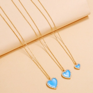 Detailed comparison of three light blue enamel heart necklaces with gold chains and zircons