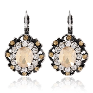 Detailed close-up of vintage leverback earrings with champagne stone and crystal halo