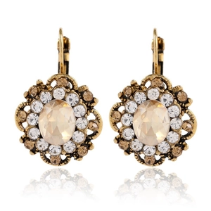 Macro detail of vintage floral crystal earrings with champagne stones and lever-back clasp