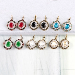 Detail showing vintage oval crystal drop earrings in six different vibrant colors