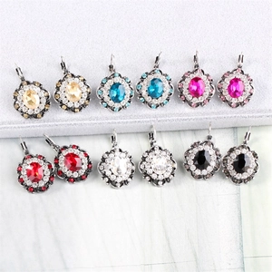 Macro shot of vintage style leverback earrings with oval crystals in six various colors
