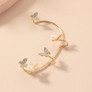 Elegant gold butterfly ear cuff with sparkling rhinestones and white pearls detail