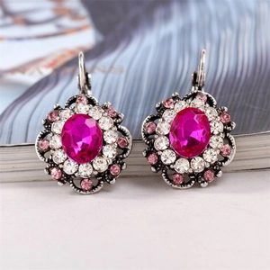 Elegant silver-tone vintage drop earrings with large oval pink crystal and small rhinestones