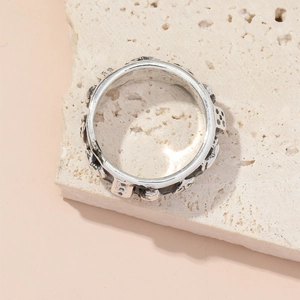 Vintage oxidized silver metal wide ring with heart and skull motifs on stone