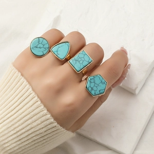 Set of four vintage gold adjustable turquoise rings in various geometric shapes for women