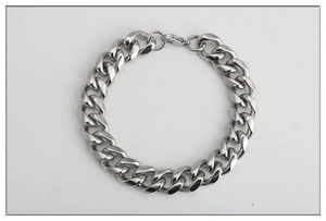 Detail of silver stainless steel Cuban link bracelet showing high-gloss finish and lobster clasp