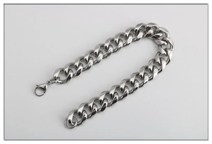 Detailed close-up of a wide Cuban link bracelet in silver stainless steel with lobster clasp