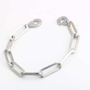 Detail of industrial stainless steel handcuff link chain bracelet with double carabiner clasps