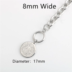 Detail view of 8mm stainless steel chain and 17mm St. Benedict religious pendant