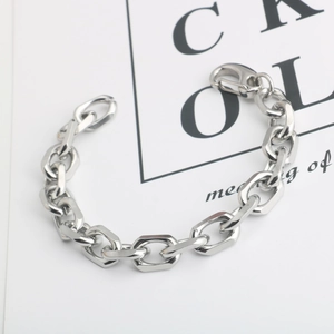 Detail shot of heavy stainless steel chain bracelet with geometric links and lobster clasp