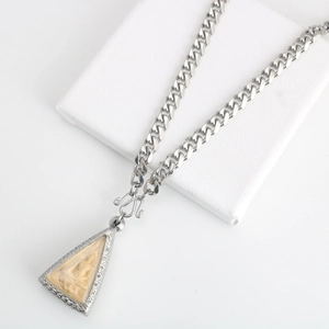 Silver stainless steel tank chain necklace with a triangular Thai Buddha amulet pendant