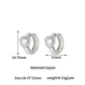 Macro shot showing dimensions of silver copper heart hoop earrings with pavé crystals