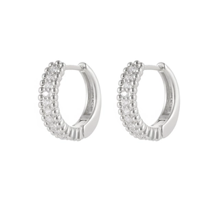 Sparkling silver hoop earrings with double-row zircon inlay on a white background
