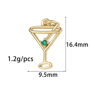 Detailed view of 14K gold-plated cocktail glass charm with green gem, 16.4mm x 9.5mm size
