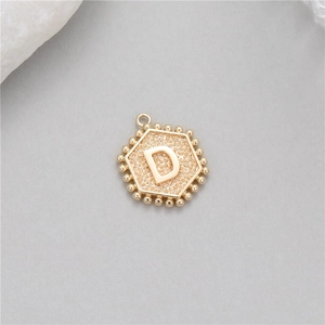 14K gold plated hexagonal initial D pendant with beaded edge and textured surface