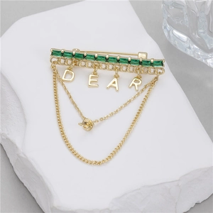 Elegant gold brooch with green crystals and DEAR letter tassel chains for suit jackets