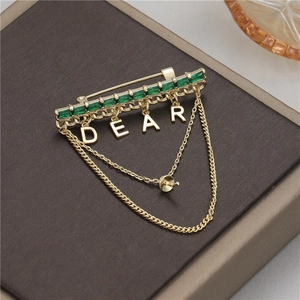 Elegant gold brooch with emerald green gemstone, DEAR letter pendants and layered chains