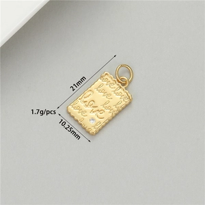 Detail of 14K gold plated Love pendant with white zircon and vintage wave edges