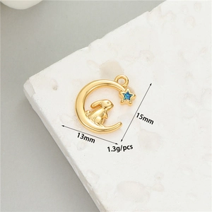 Macro shot of gold moon and rabbit charm with dimensions 13mm by 15mm for DIY jewelry