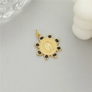 14K gold plated sunburst pendant with religious relief and black zircon stones