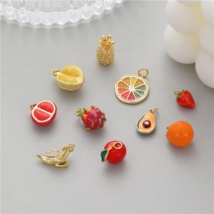 Assorted colorful enamel fruit charms including strawberry and avocado for DIY jewelry