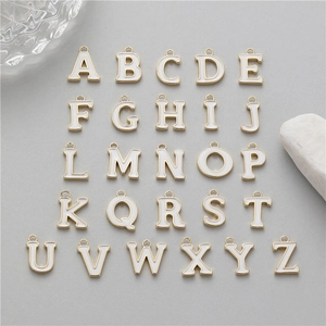 Detailed set of 26 A-Z gold alloy alphabet pendants with white enamel drip oil finish