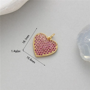 Detailed view of pink zircon heart pendant with gold finish, 18.1mm size dimensions