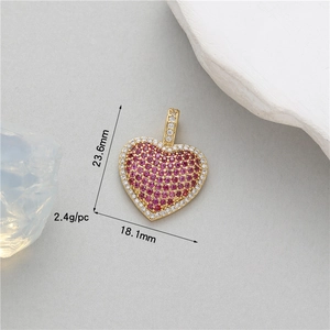 Detailed view of a gold heart pendant with purple zircon inlay and size dimensions